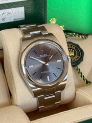 Pre-owned Rolex Oyster Perpetual 39mm Grey Dial 114300 2018 Box and Papers